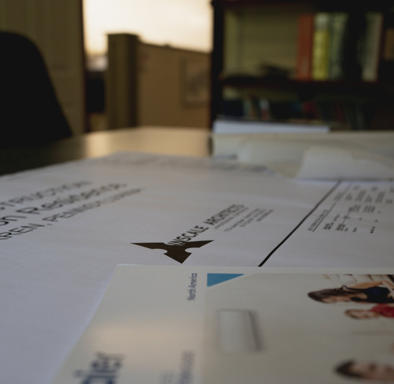 Drawings and literature on work table Drawings and literature on work table